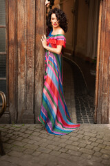 Woman wearing flowers dress in hot summer city