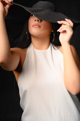 Woman in black hat