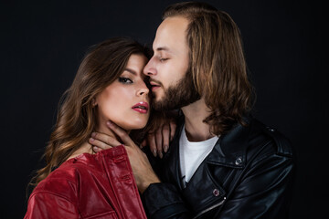 fashionable couple in leather jacket. bearded long hair man caress woman. love and romance.