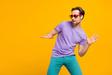 Profile photo of funny cool dj guy play popular track wear sunglass purple t-shirt isolated yellow...