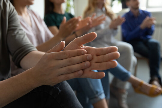 Hands of audience applauding speaker, presenter for speech, presentation, training. Group of employees expressing recognition and acknowledgement to colleague or team leader, clapping hands. Close up