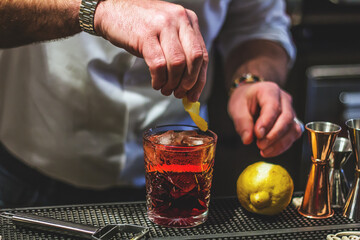 Americano: bartender pouring a cocktail