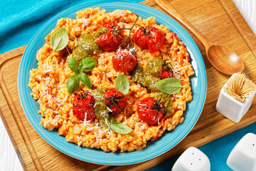 creamy tomato risotto with pesto, top view