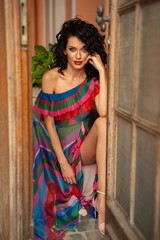 Fashion spanish young woman posing in summer dress