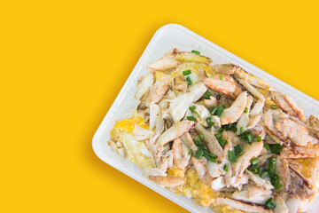 Thai food called Khao pad poo. Delicious Fried rice with crab condensed eggs on a colored background.