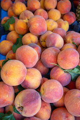 Ripe peaches, farmers market counter, harvest sale. Background image with place for text.