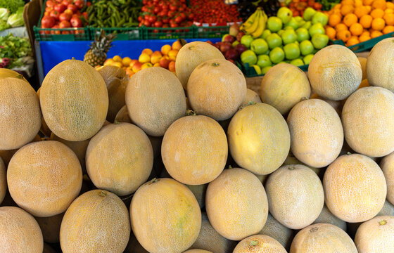 Ripe melon, farmers market stall, harvest sale. Background image with place for text.