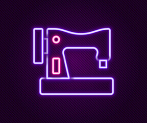 Glowing neon line Sewing machine icon isolated on black background. Colorful outline concept. Vector