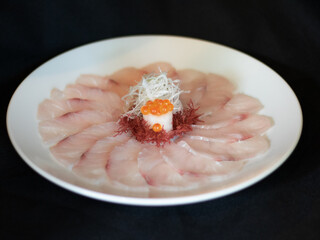 Suzuki Usuzukuri or White Snapper sliced with Ponzu Sauce and Lemon sliced.