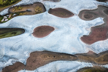 Aerial view of the meanders of a bedrock river during the summer drought.