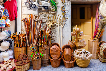 Morella, Spain - July 9, 2021: Baskets and other tourist souvenirs on a tourist street.