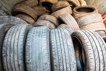 Obraz premium Rubber tires pollute the air in cities, they are retired to be recycled.