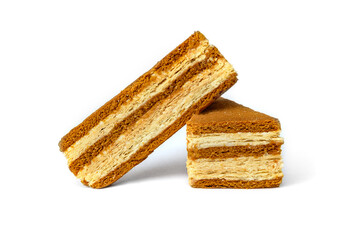 Slice of honey cake isolated on white background.