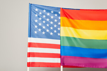 american and lgbt flags isolated on grey, equality rights concept