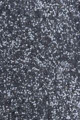 Black fabric strewn with sequins and small beads