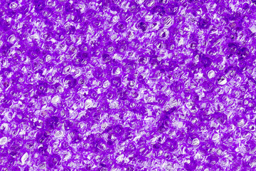 texture of purple foam sponge close-up for background
