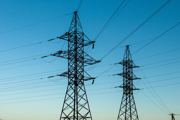 high voltage line of electrical wires on blue sky background