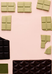 Different bars of chocolate on a pink background. View from above