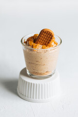 Caramel cheesecake in glass with biscuit 