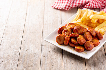 traditional German currywurst on rustic wooden table. typical oktoberfest food
