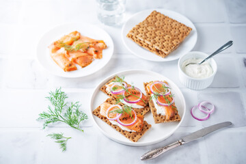Picked salmon cream cheese rye bread in a plate