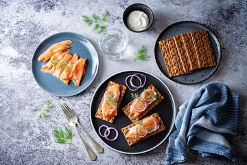 Picked salmon cream cheese rye bread in a plate