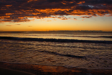 Fototapeta na wymiar Cloudy sunrise on a beach in Benicasim