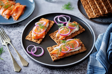 Picked salmon cream cheese rye bread in a plate
