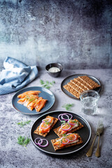 Picked salmon cream cheese rye bread in a plate