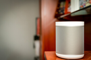 detail of a smart home speaker in the living room furniture of a home automation system house..