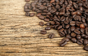 Coffee bean on grunge wooden background.	
