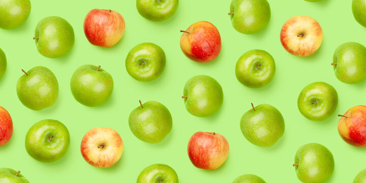 Green and red apple fruits over green seamless
