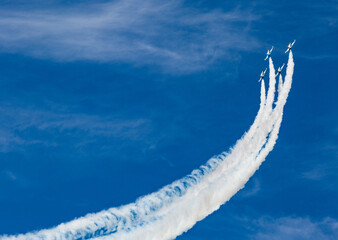 fighter planes taking off and leaving a white trail