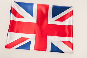 top view of national flag of united kingdom with red cross isolated on white