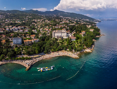 Beautiful panoramic view of Lovran village and its sea shore in Croatia. Top view photo taken on drone.
