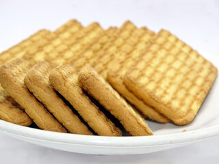 Tea biscuits differ on white blur background
