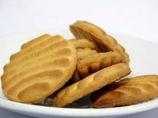 Tea biscuits differ on white blur background