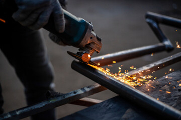 Metal processing in the workshop. Grinding metal.