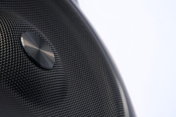 Metal grill of audio speakers on a white background. Concept for audio technology, digital music,...