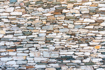 Vintage stone wall background and texture, Cyclades islands Greece.