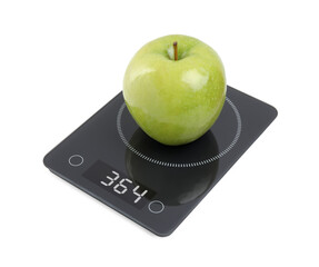 Ripe green apple and electronic scales on white background
