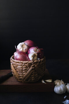 Onion and garlic raw Ingredients On Dark Background