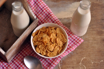 Cereal with milk on wooden top