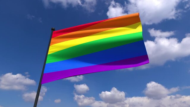 LGBTQ Pride Flag Waving. a LGBTQ pride flag waving in front of blue cloudy sky background also with black background and matte for isolation