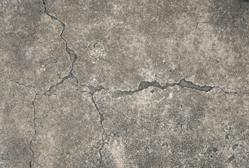 Obraz premium cracked cement covered with gray cement surface as background for design