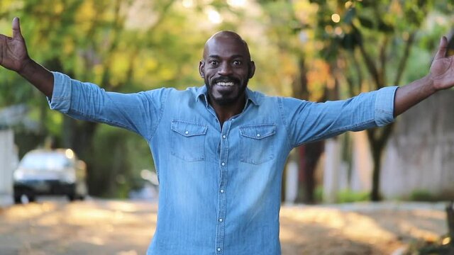 African man WOW suprise open arms reaction