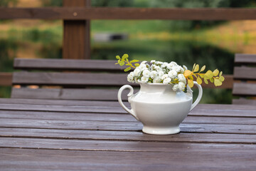 bouquet of flowers with a vase street cafe