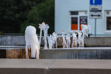 small city fountain with water and light
