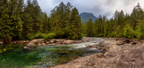 Panoramic View of the river in the Canadian Mountain Landscape. Cloudy Evening Sky. Golden Ears Provincial Park, near Vancouver, British Columbia, Canada.