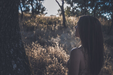 Mentall illness concept, overcome depression. Young woman feeling anxiety, lost in the forest.